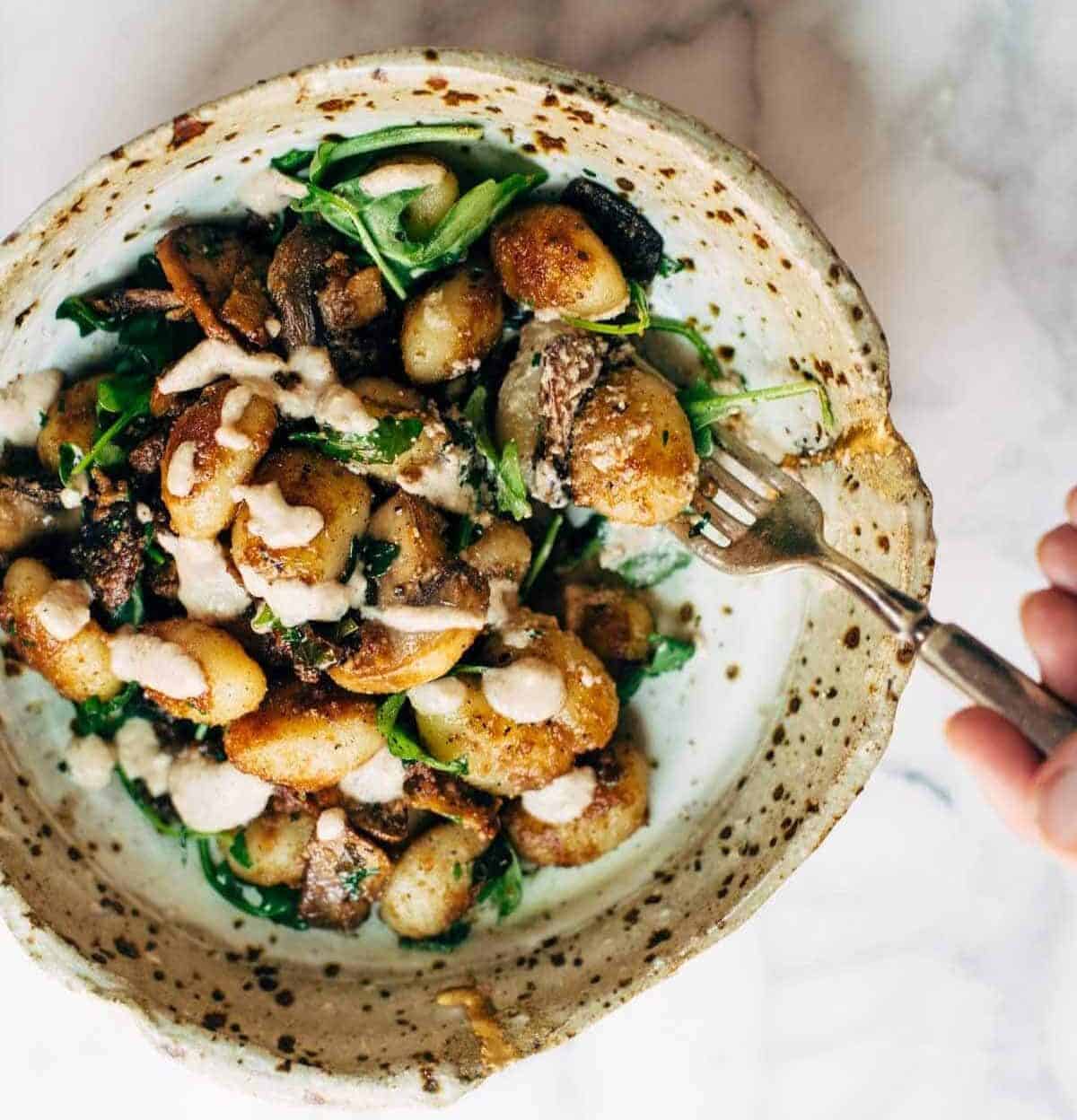 Mushroom Gnocchi with Arugula and Walnut Pesto